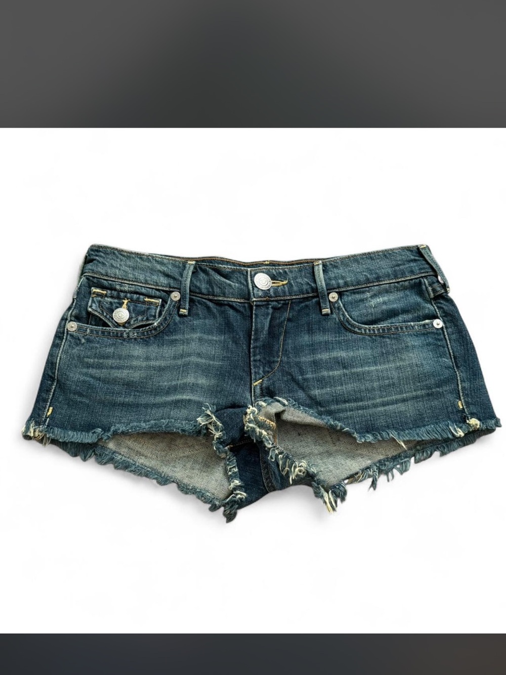 True Religion low rise Dark Blue Denim Frayed Hem Shorts. Size 25